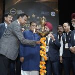 Image - Shri Nitin Gadkari, Hon'ble Minister for Road Transport and Highways, and Mr. Prakash Sangam, CEO of redBus, along with other dignitaries, lit the lamp to inaugurate the Bharat Prawaas Awards